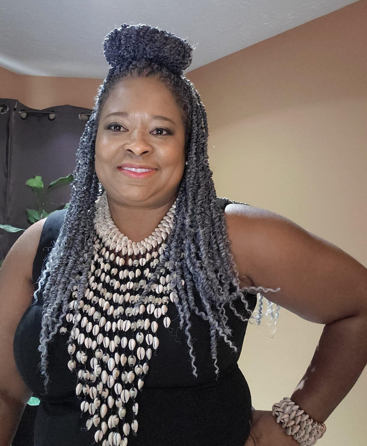 Cascading cowrie shell statement necklace handmade in Africa